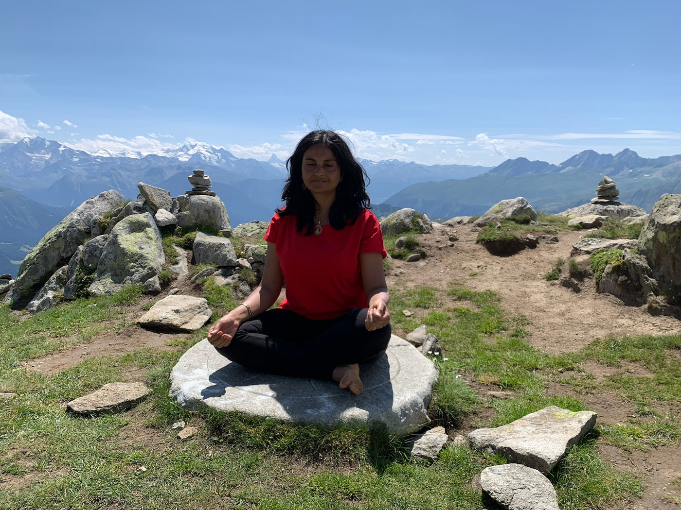 Sejal meditating in the mountains