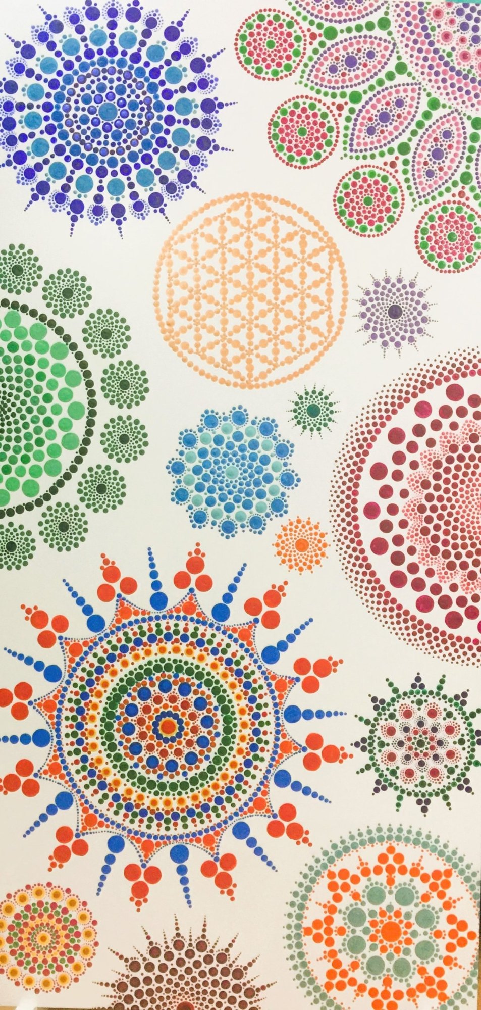 A large white canvas filled with colourful dot mandalas by Sejal